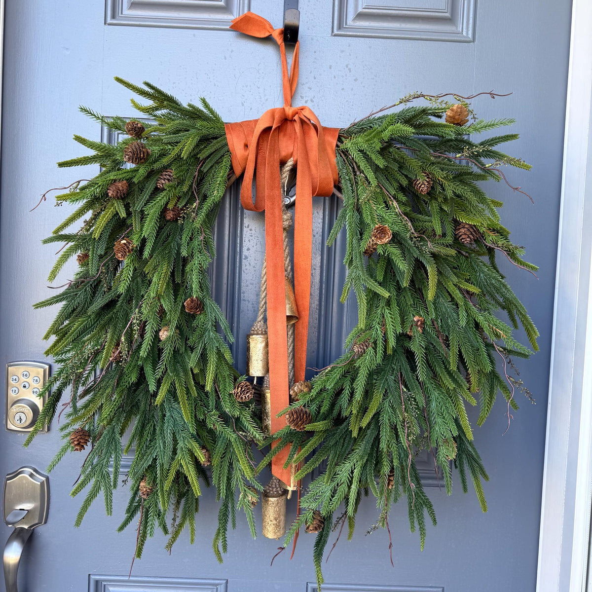 Fall greenery norfolk pine front door wreath with brass bells