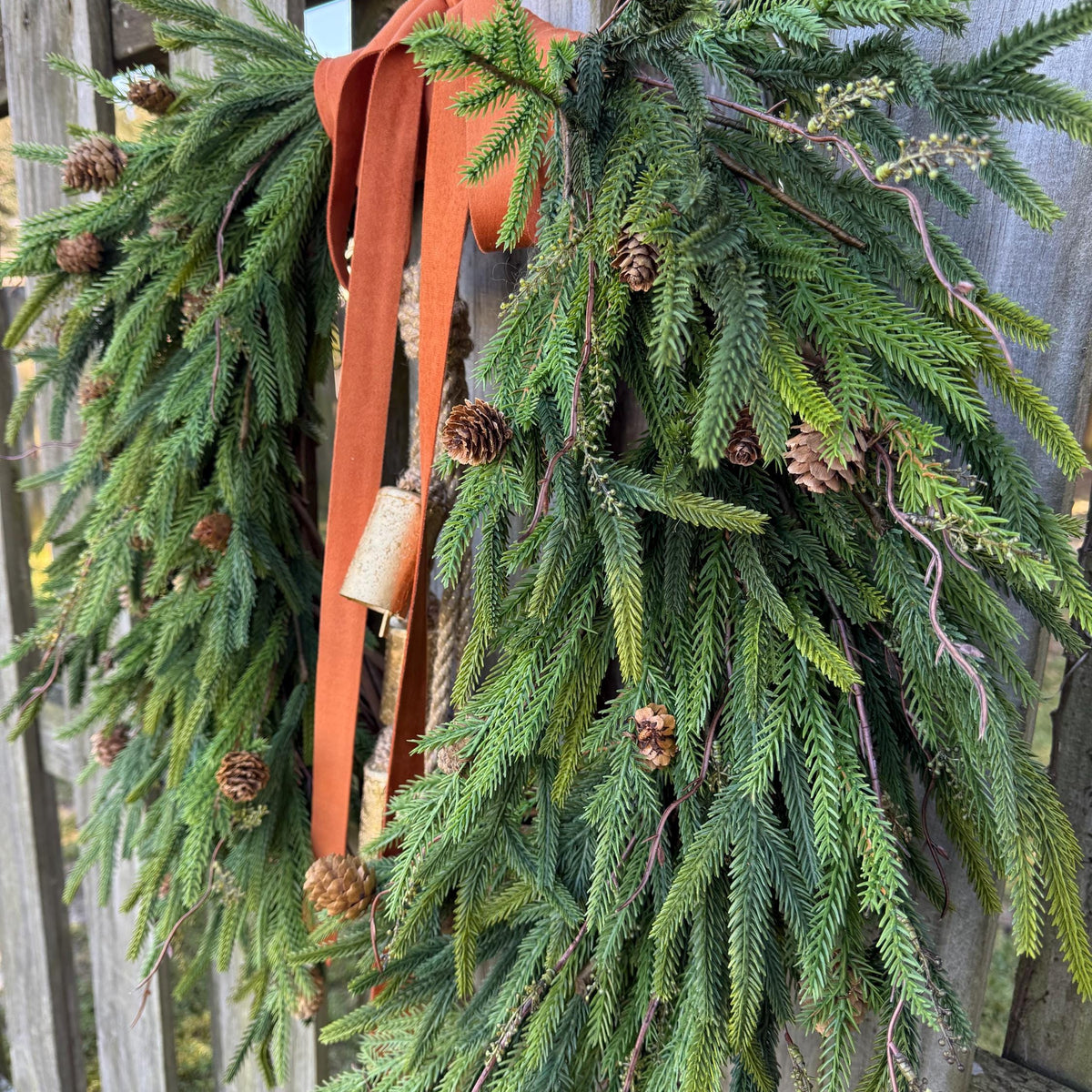 Fall greenery norfolk pine front door wreath with brass bells
