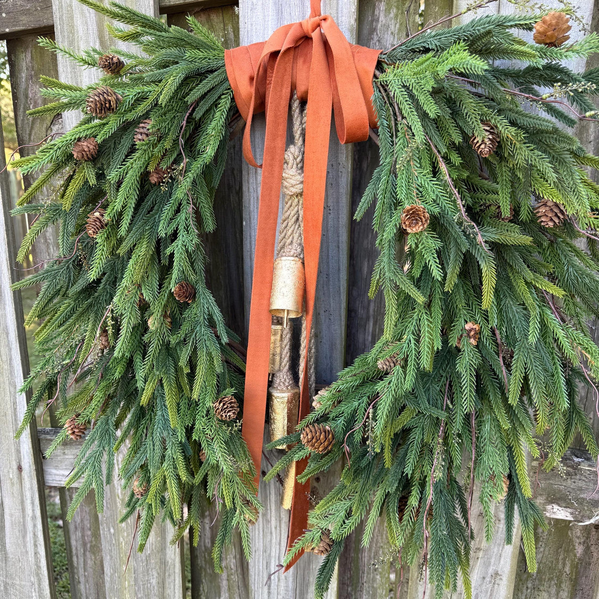 Fall greenery norfolk pine front door wreath with brass bells